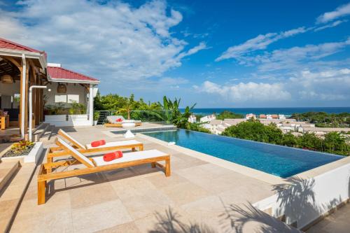 Saint-Francois Villa | Résidence Les Raisins Clairs - Villas standing 4 étoiles , vue sur mer panoramique & piscine à débordement