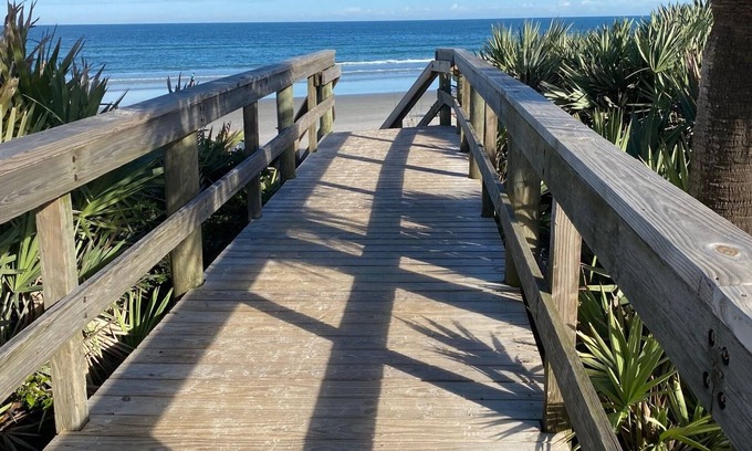 New Smyrna Beach Condo | Resort style amenities in spacious condo with beach access and direct pool view.