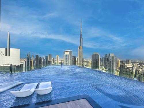 Trade Centre 1 Apartment | Restay Homes at Paramount Midtown Hotel - Highest infinity pool access with Burj View