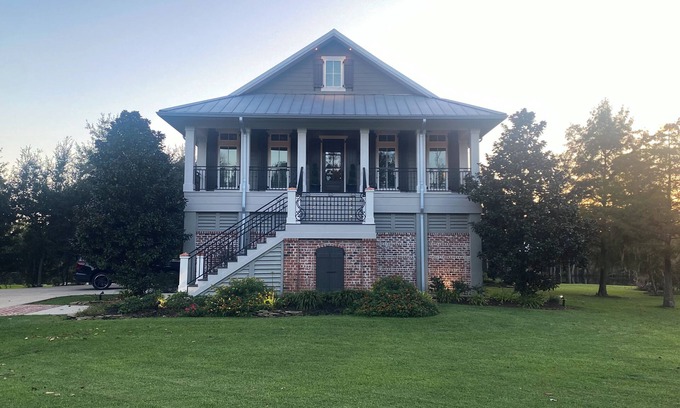 Lake Charles House | River front paradise with large dock and outdoor space, great for entertaining.