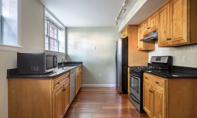 North Cambridge Apartment | Sleek Porter Square 1BR w/ Gym & W/D, nr T Stops, by Blueground