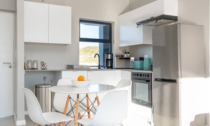 Mykonos Apartment | Stylish Urban Stay | Balcony | Braai Area