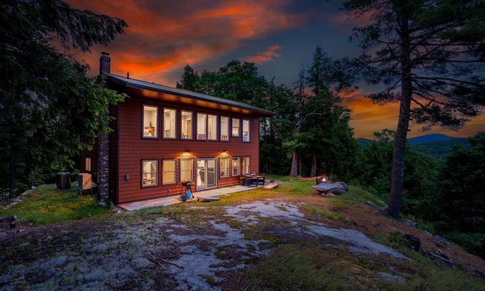 Bryant Pond Cabin | Sweeping mountain and water views from a top a mountain side