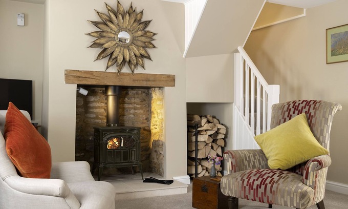 Minchinhampton Cottage | This charming Cotswold stone cottage, elegantly furnished with a seamless blend of antique and conte