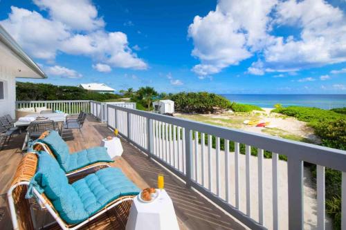 North Side Villa | Timmys Place - Charming Oceanfront Villa with Direct Beach Access and Scenic Views