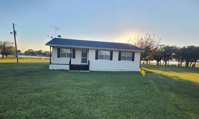 Eastland House | Tranquil Lake House on 2 Acres: Pet-Friendly with Stunning Lake Views.