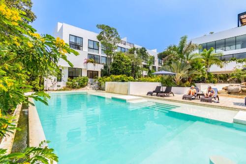 Akumal Apartment | Tropical Bliss Apartments 3 Pools Rooftop Lounge and Gym