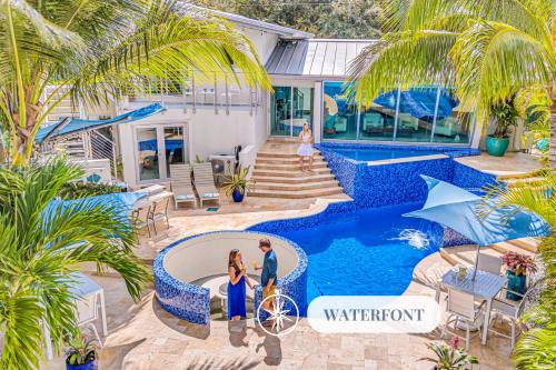 Riverside Park House | Waterfront Oasis Cascading Pool Views Centrally located Heated Pool Cascade KeyResidences