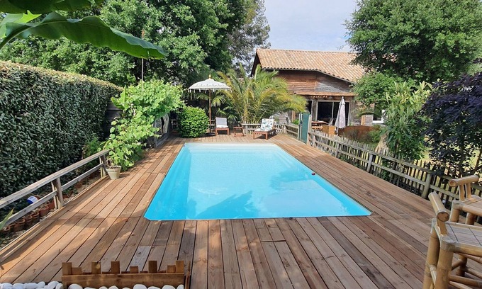 Benesse-Maremne House | wooden house with swimming pool and tropical garden