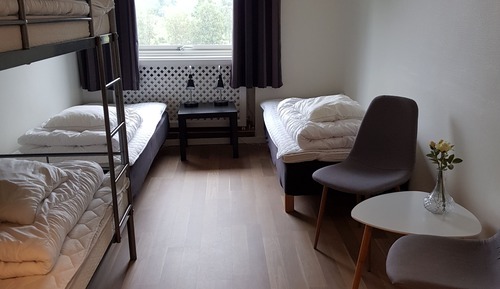 Quadruple Room - 2 Single Beds and 1 Bunk Bed - Shared Bathroom