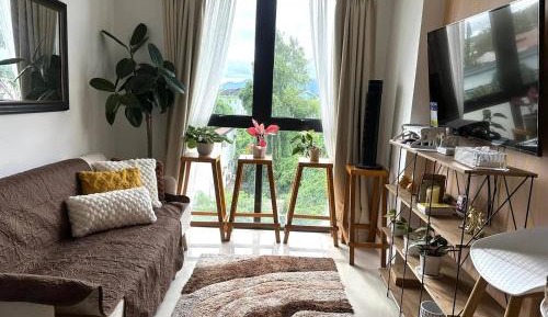 One-Bedroom Apartment with Balcony and City View