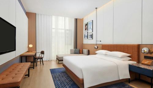Executive One-Bedroom Suite with King Bed, Sofa Bed, and Garden View