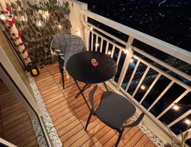 One-Bedroom Apartment with Balcony and City View