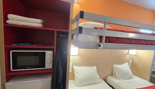 3 Single Beds With Shared Bathroom And Toilet