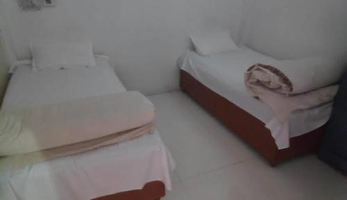 Single Bed in Dormitory Room
