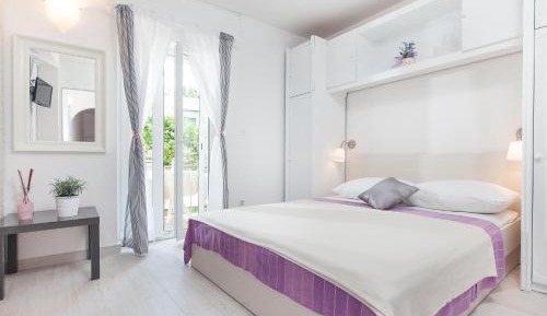 Studio with balcony and backyard view