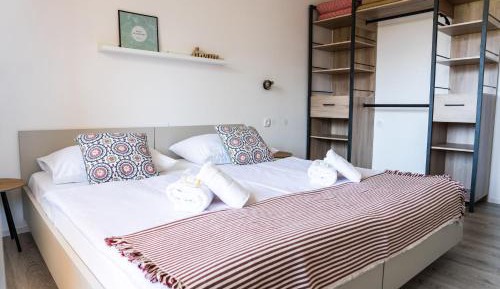 One-Bedroom Apartment with Balcony and Lake View