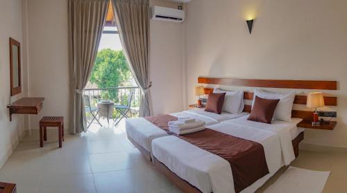 Staycation Offer: Deluxe Twin Room with Balcony & Canal View (10% off on Food & Beverage and Free Early Check-in & Check-out on Availability)