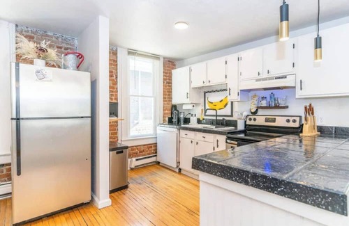 City Park Apartment | Stylish Uptown Retreat - 2BR with Sunroom/Office and Movie Room