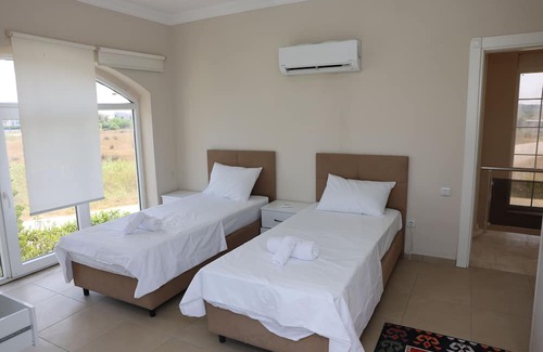 Belek Villa | A large swimming pool in a tranquil environment, offer a blend of comfort.