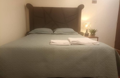 Puno House | Cozy room with TV and private bathroom
