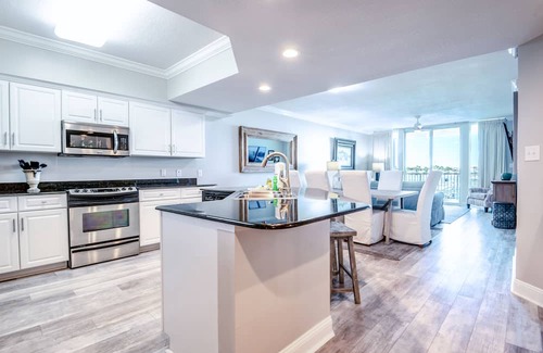 Orange Beach Condo | Luxe & Comfy Waterfront Gem: Heated Pool, Sandy Beach, Kayaks, Panoramic Views!