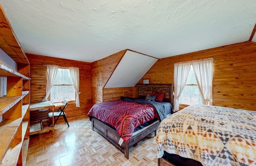 Cheboygan Cottage | Lakefront stay with two kayaks, jetted tub, wood stove, & W/D - dog-friendly