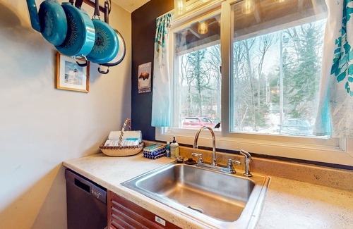 Greenville Junction Condo | First-floor condo near lake/skiing/hiking with beach access, lake view & patio