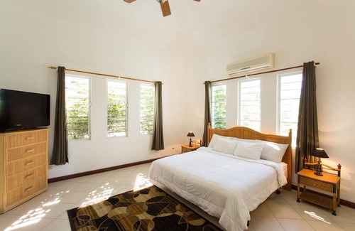 Island Harbour House | Exquisite 3 Bedroom villa. Unwind with beach views, and gentle island breezes.