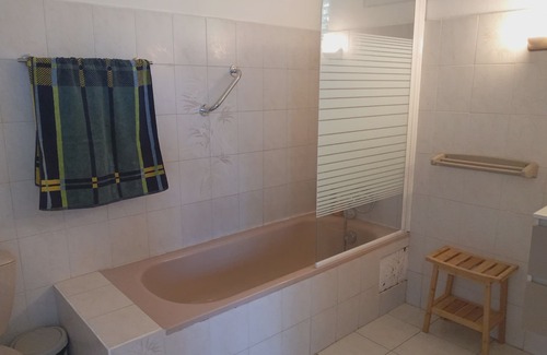 Les Abymes Apartment | Charming studio in a tropical garden. with swimming pool, free wifi and parking.
