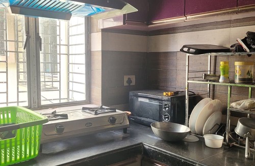 Thakurpukur Apartment | Elegant Spacious 2-bedroom AC Apartment balcony Kolkata Tollygunge~ pet friendly