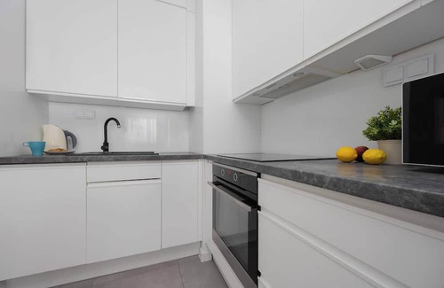 Ursus Apartment | Posag 7 Panien 16 Warszawa | Grey Apartment with Balcony