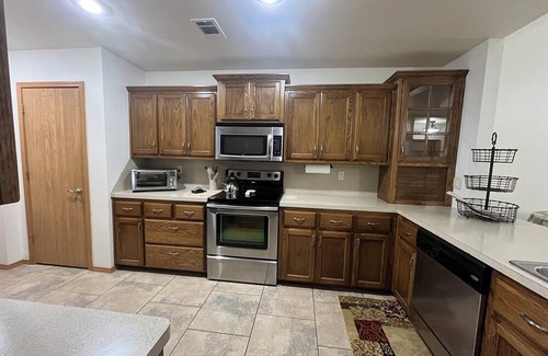Spiro House | Upscale home with high end furnishings and memory foam king bed. 2 car garage
