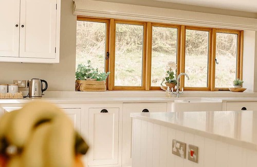 Acrefair House | A luxurious riverside cottage with stunning views, a hot tub, and fishing access.