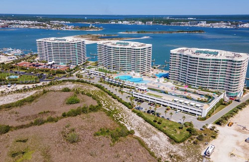 Orange Beach East Condo | Luxurious Bayside Four Bedroom Condo with Panoramic Views. Complimentary Boat Slip!