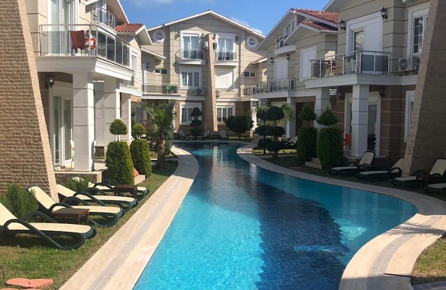 A large swimming pool in a tranquil environment, offer a blend of comfort.