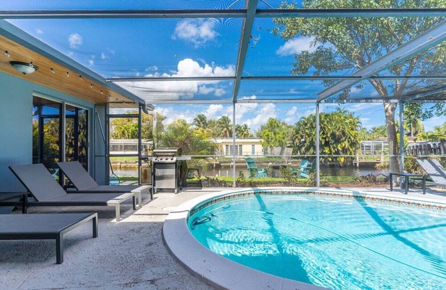 Charming Poolside Haven on Water's Edge