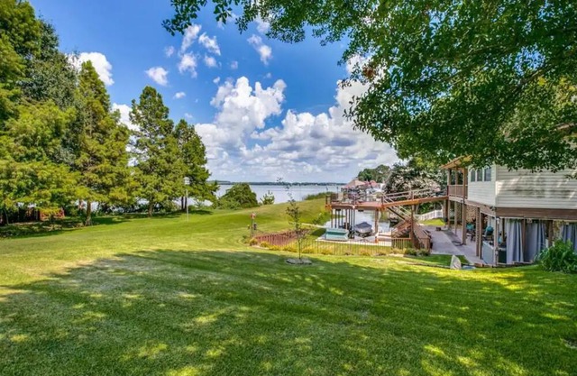 Idyllic lakefront oasis with private hot tub, fire pit, deck, & incredible views