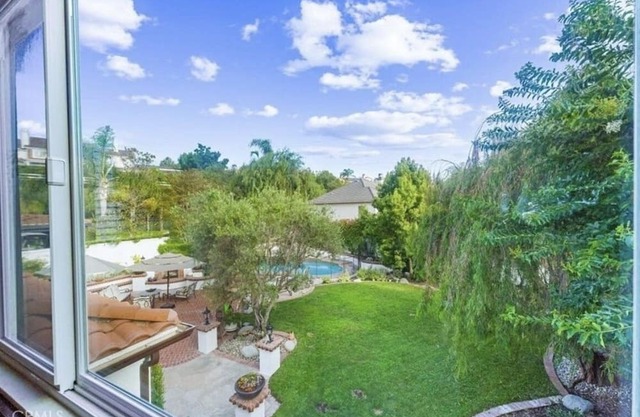 Immaculate Spanish Hacienda Style Estate on large private lot!