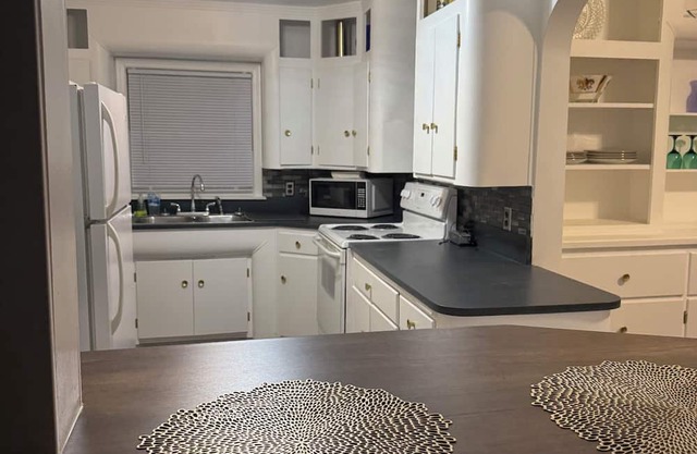 Beautifully restored, fully furnished 3 bedroom home one block from downtown