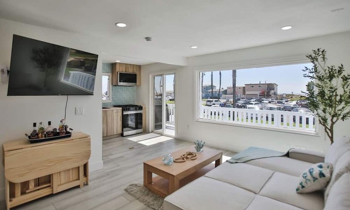 Huntington Harbour Cottage | STEPS TO PRIVATE BEACH FRONT PANORAMIC OCEAN VIEWS! Home - parking lot - sand.