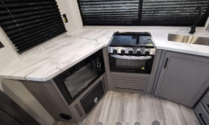 Thomson House | Come play with Scottish highland cows in a beautiful and cozy brand new RV!