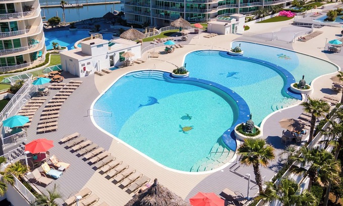 Orange Beach East Condo | Luxurious Bayside Four Bedroom Condo with Panoramic Views. Complimentary Boat Slip!